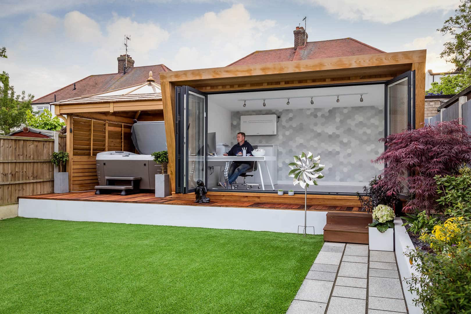 man working from a garden room