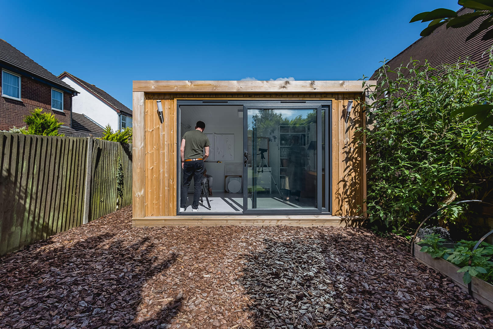 4x3m edge garden room with cedar cladding and 3m sliding