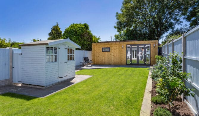 modern summer garden with garden room and shed
