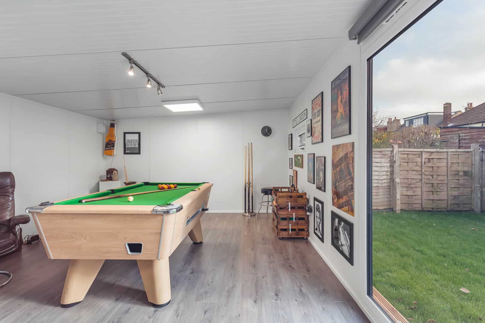 Pool table with storage and pool cues