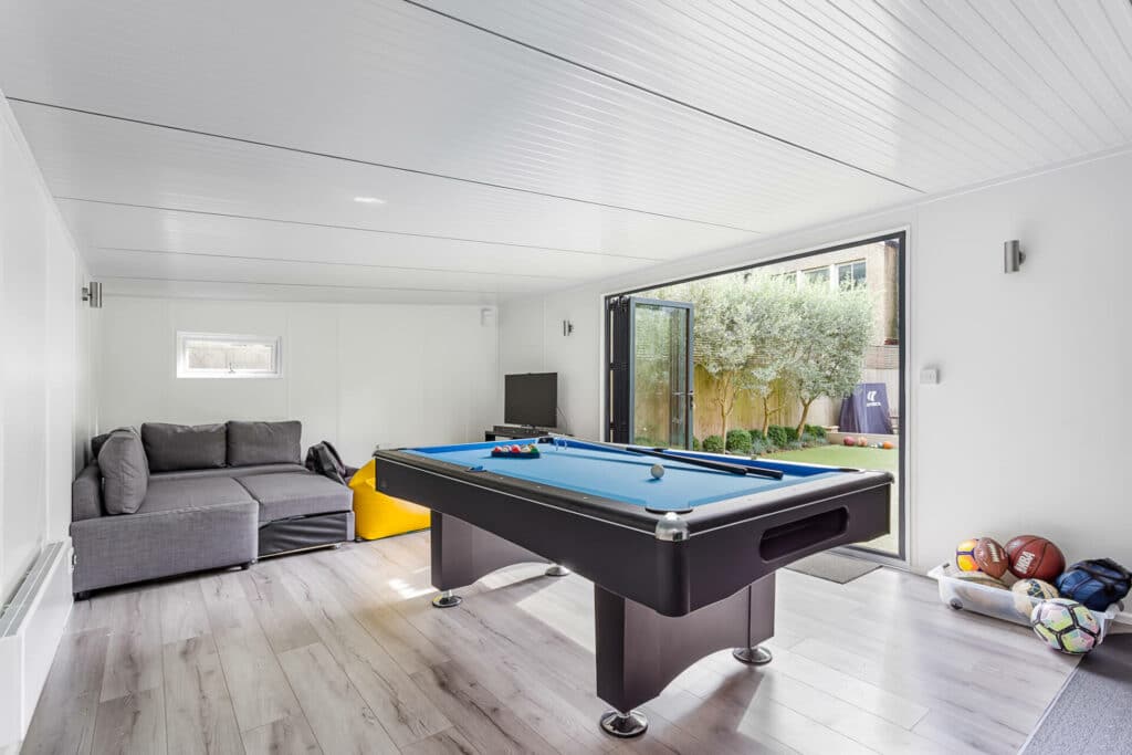 teen den games room with pool table and footballs 