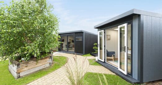Grey painted and black painted garden room side by side