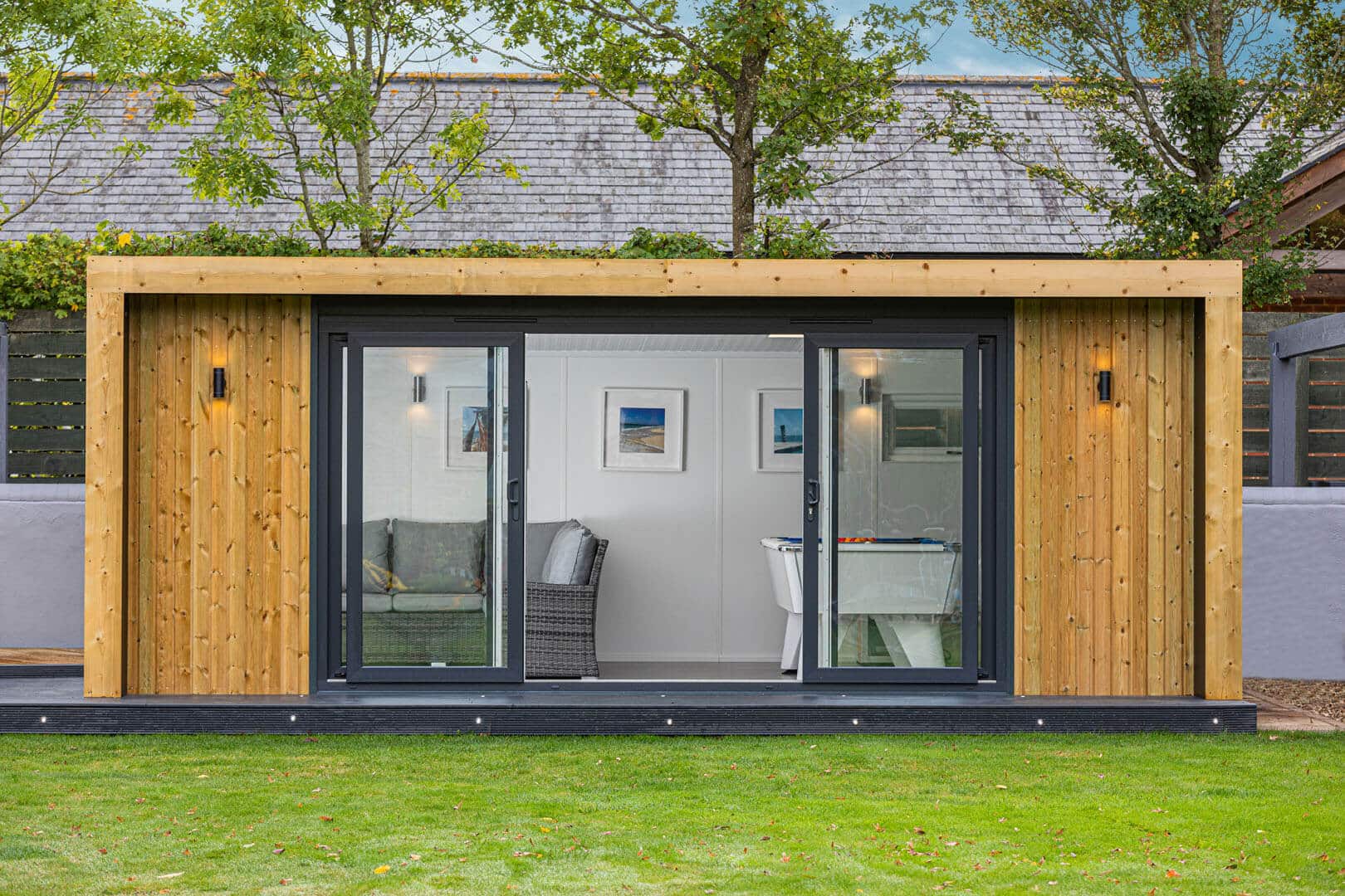 Exterior image of a Green Retreat games room with open doors