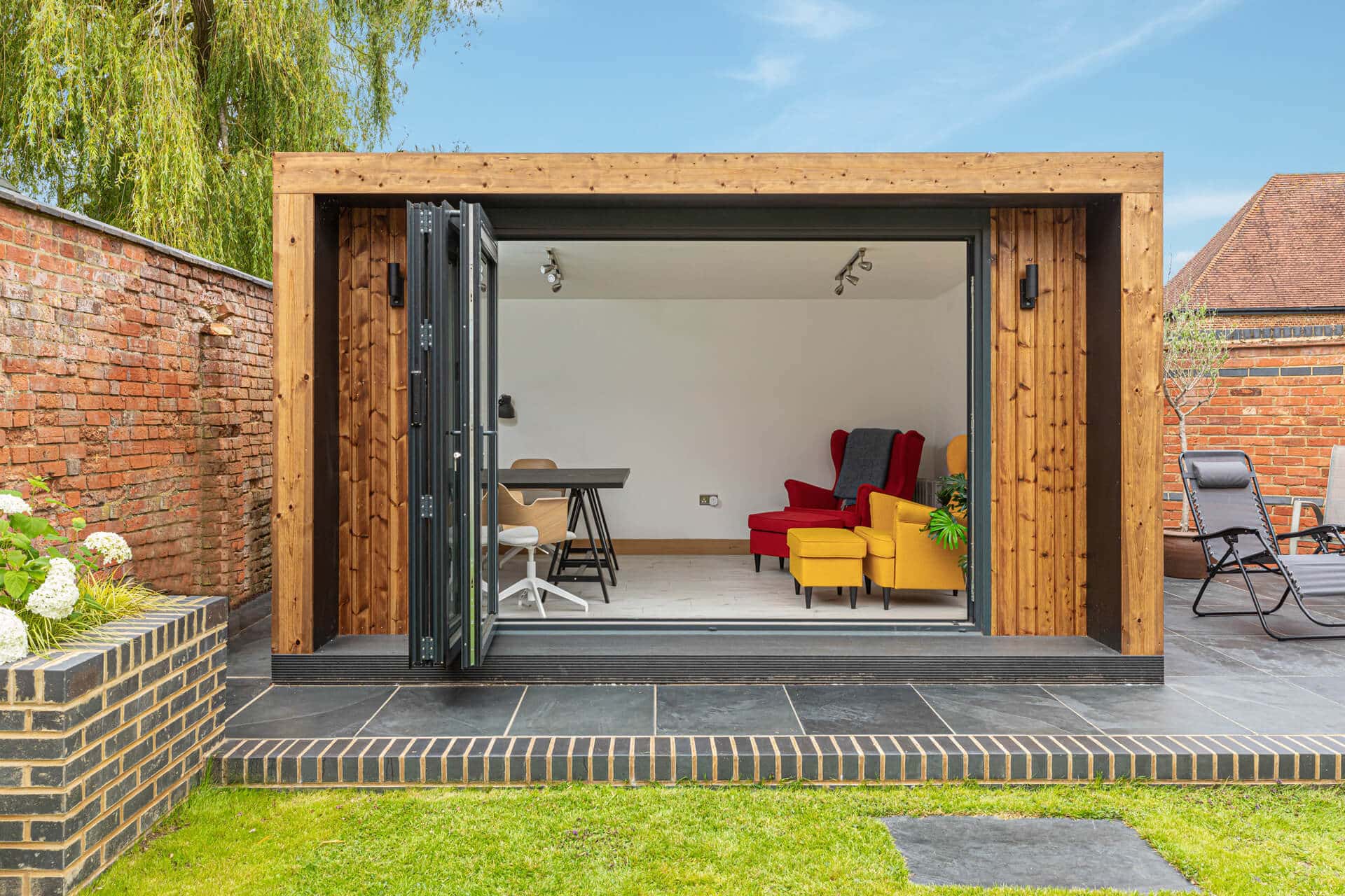 Modern edge design garden room with open bi-folding doors