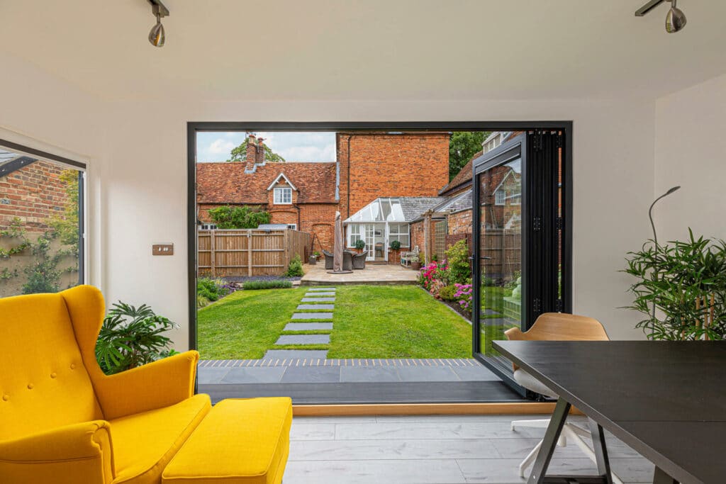 bi-fold doors view of listed house