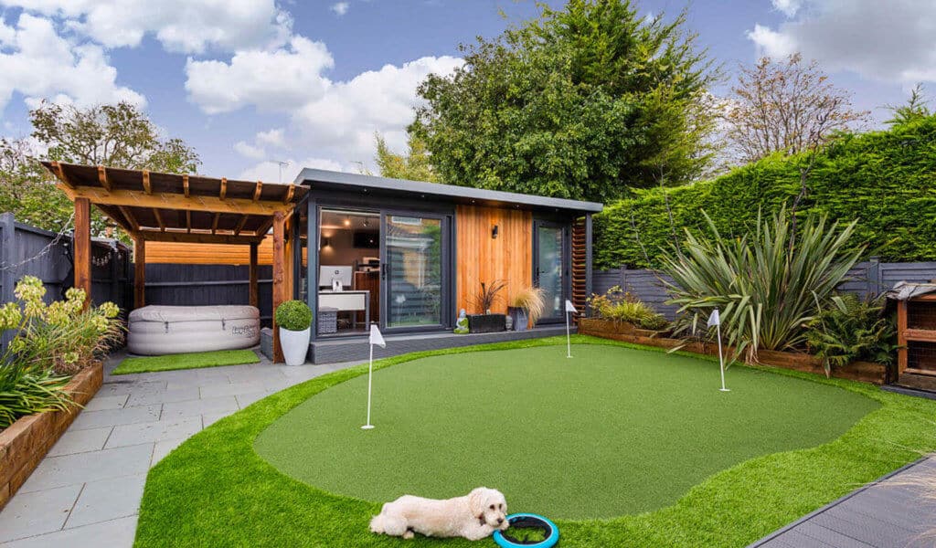 Garden room office with golf putting green in front