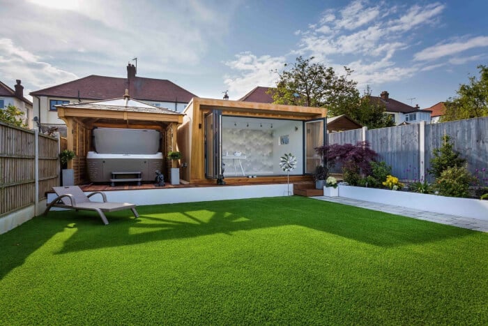 luxury garden room with bi-fold doors and hot tub