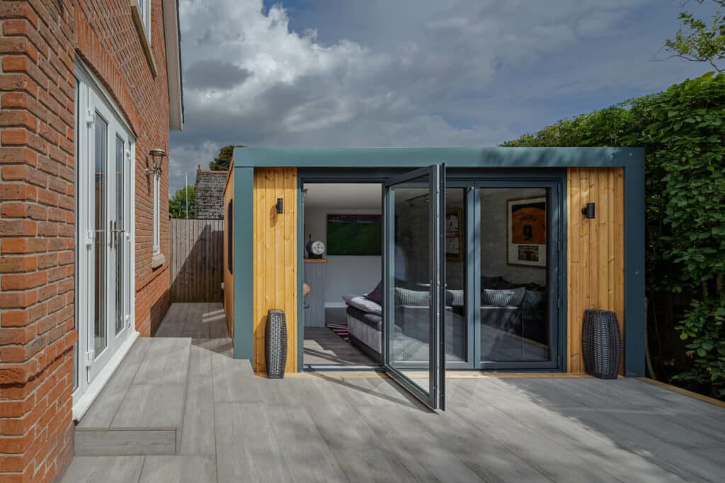Exterior of Inspiration with bi-folds slightly open looking into a man cave