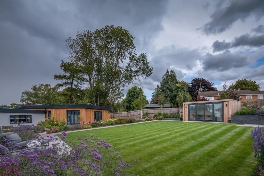 garden room in modern garden with lawn
