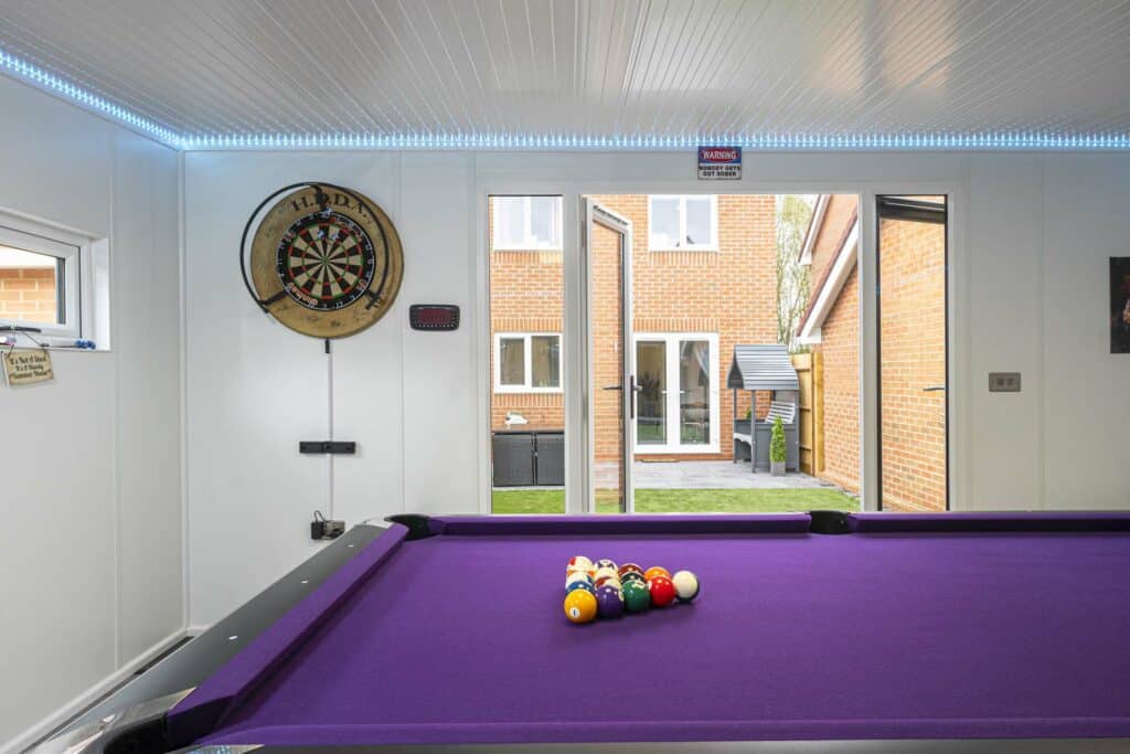 Inside of the games room over looking the garden / house