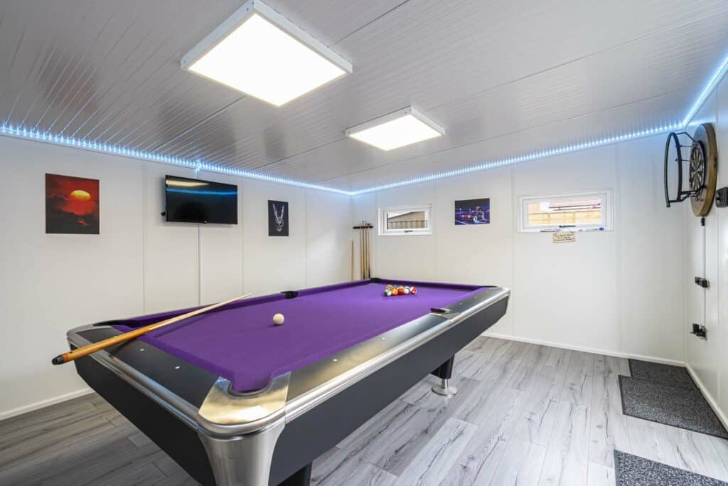 Inside of the garden room, purple pool table of show