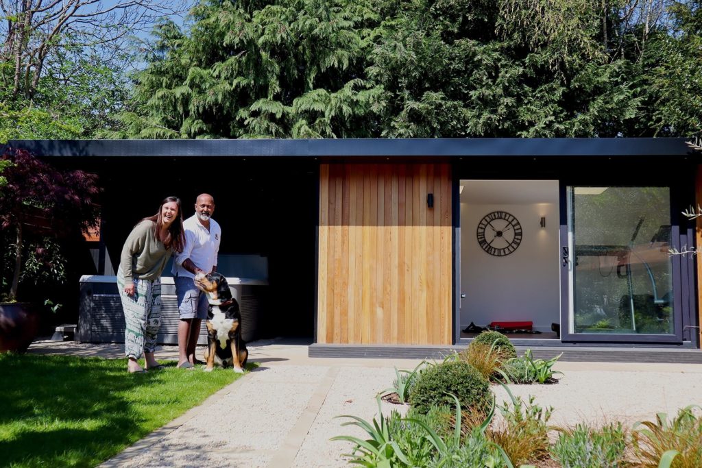 Garden room with the two owners and their dog