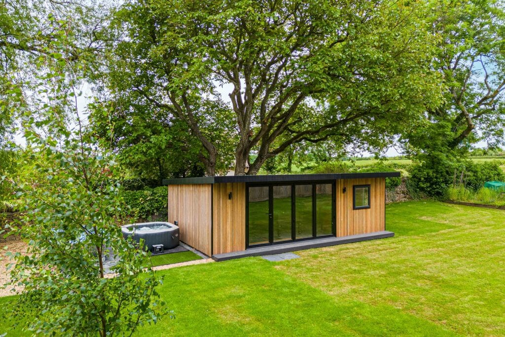 wide shot of garden room in a countryside setting
