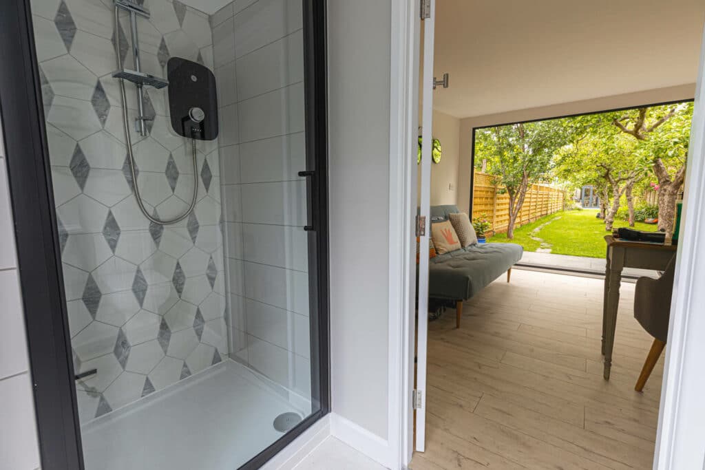 shower of garden room with decorative tiling
