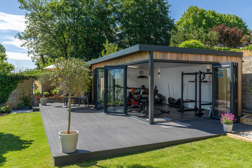 green retreats luxury garden gym with doors open in the sunshine