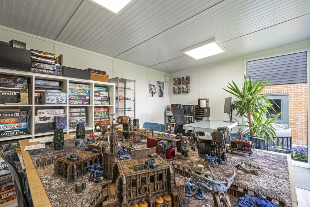 interior of garden room with war hammer board game on show