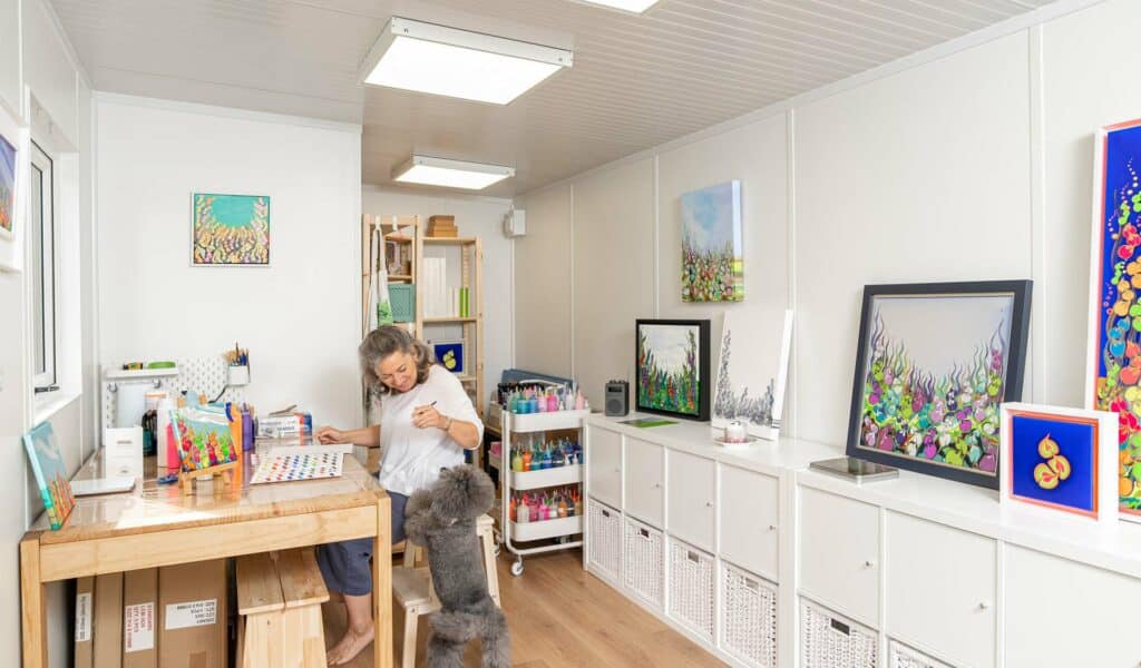 customer work from home with her dog sitting in a garden art room