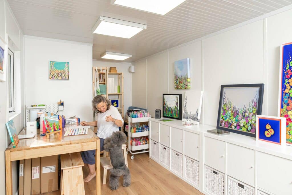 customer with her dog sitting in a garden art room