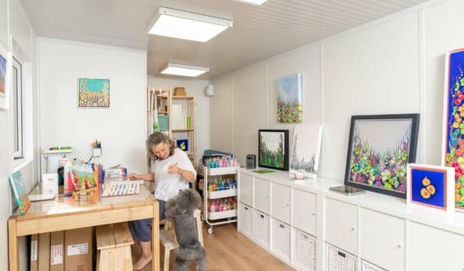 customer work from home with her dog sitting in a garden art room