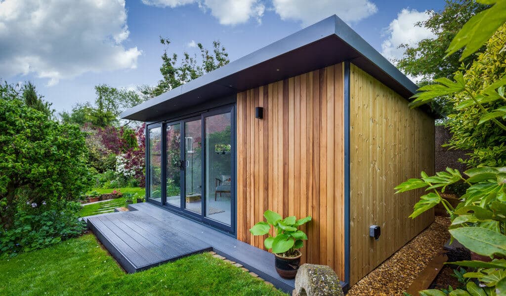 Wooden Garden Art Studio Building in luscious green garden