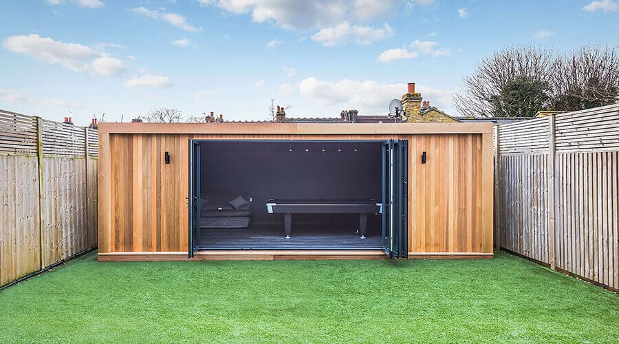 garden room man cave with sofa and pool table