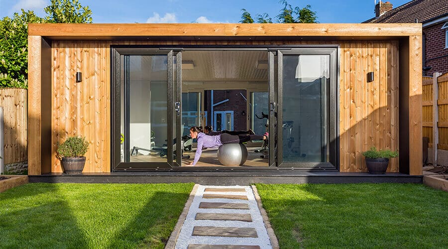 woman on exercise ball in garden room