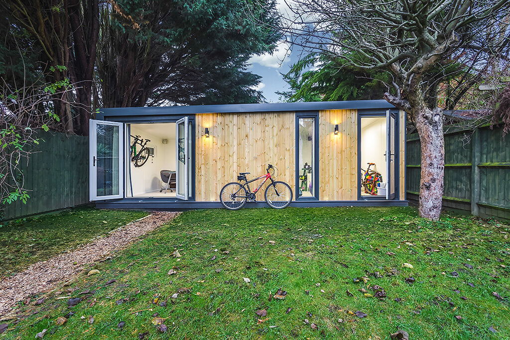 garden office building with bicycle storage shed outside